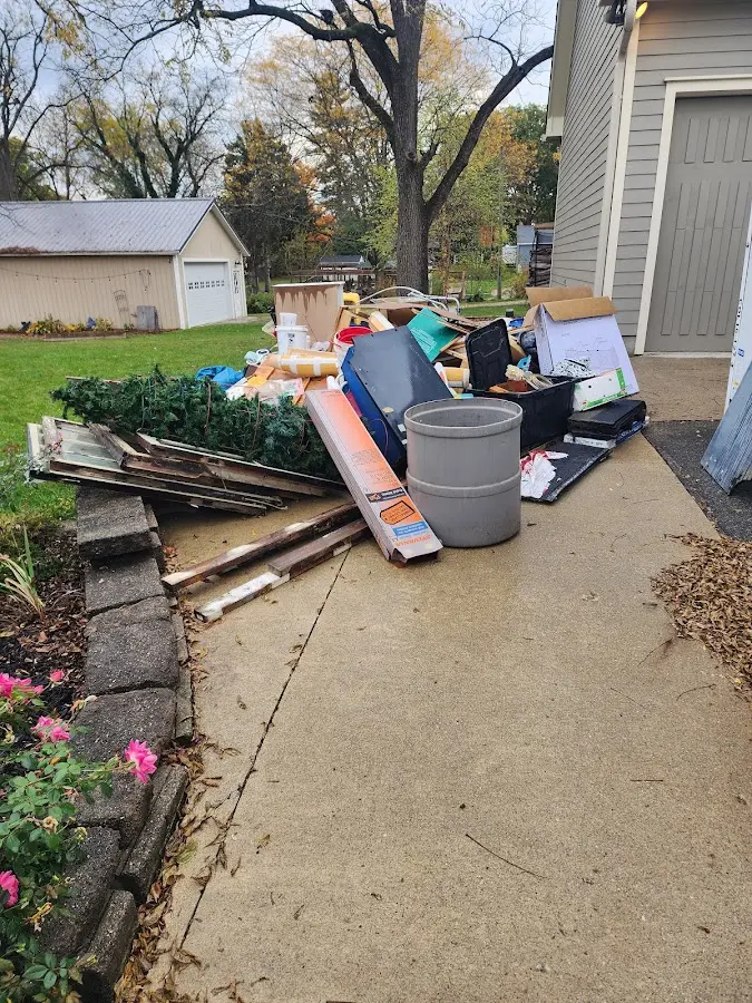 Dumpster being loaded with debris for Demolition Dumpster Rental in Montgomery